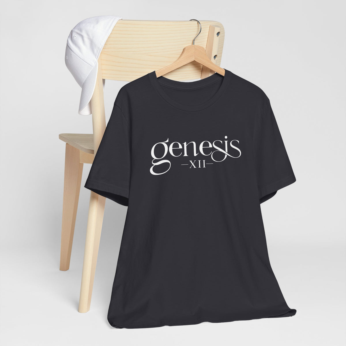 Dark Grey  Christian t-shirt with 'Genesis XII' text on a hanger against a white background