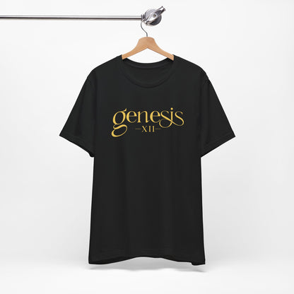 A black short-sleeve t-shirt hanging on a wooden hanger from a metal clothing rack, featuring the text 'genesis XII' printed in a gold serif font across the chest.